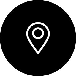 black circle with white design of a location drop