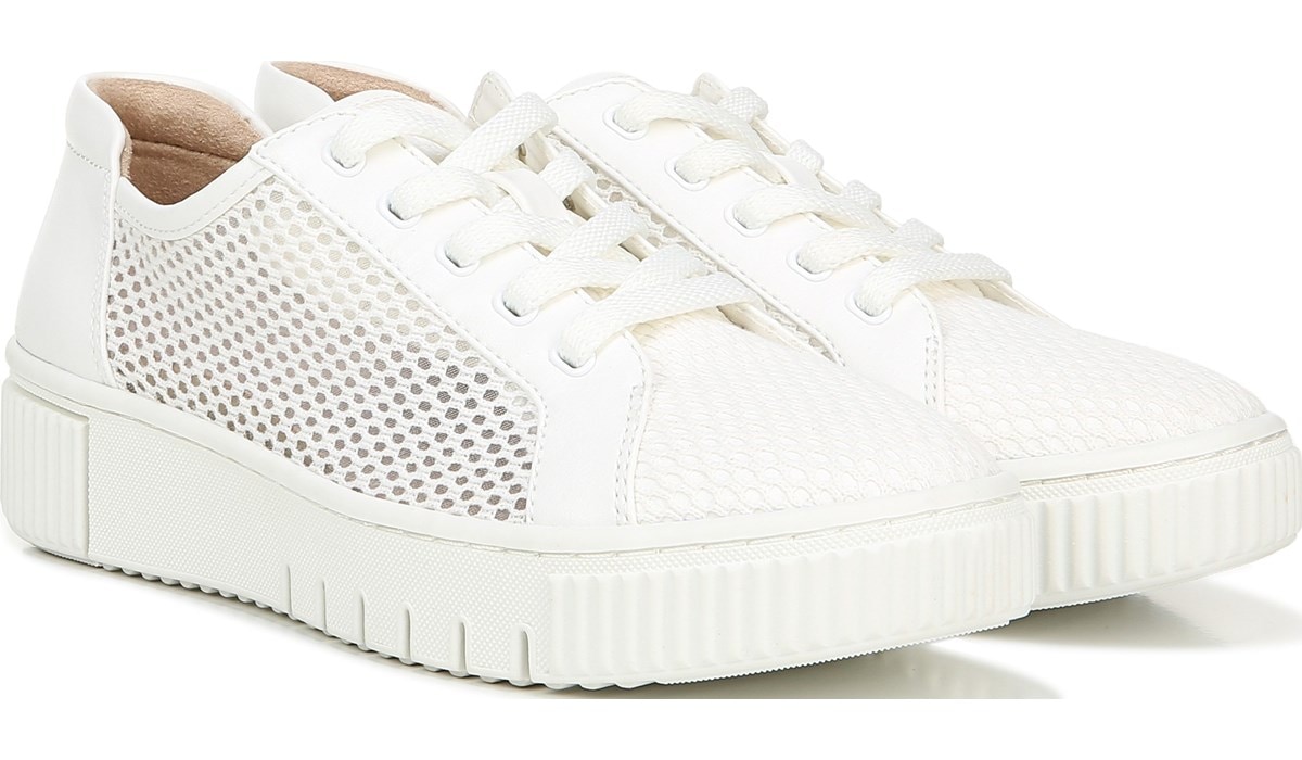 white pair of sneakers